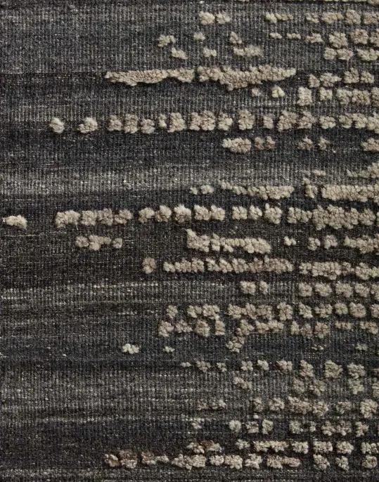 Vintage gray textured carpet with modern abstract patterns, perfect for stylish home interiors.