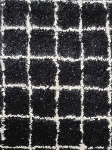 Boden - LLC-BW-44 Luxurious black and white checkered area rug with plush texture, ideal for enhancing living room or bedroom decor.