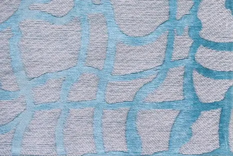 Modern abstract carpet with blue and gray pattern for contemporary flooring design.