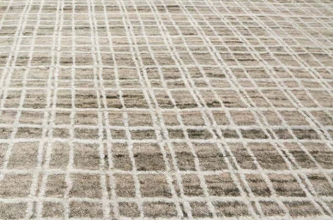 Modern patterned carpet with neutral tones, ideal for residential and commercial spaces.