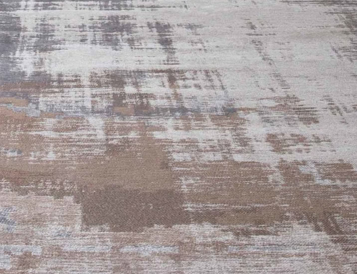 Faded textured area rug in neutral tones, perfect for modern interior decor.