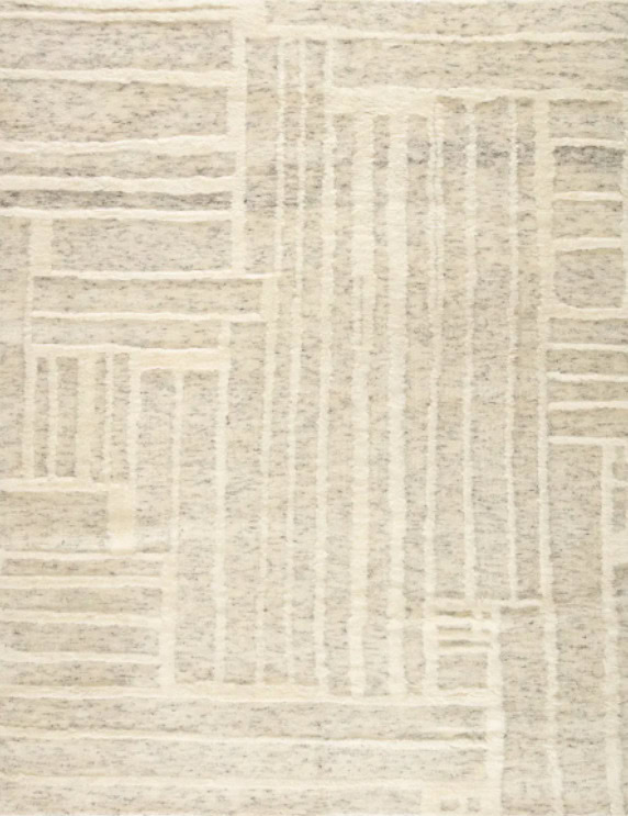 Soft beige geometric patterned modern area rug, perfect for contemporary home decor.