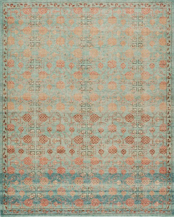 Intricate vintage area rug with floral and geometric patterns in soft blue and coral tones.