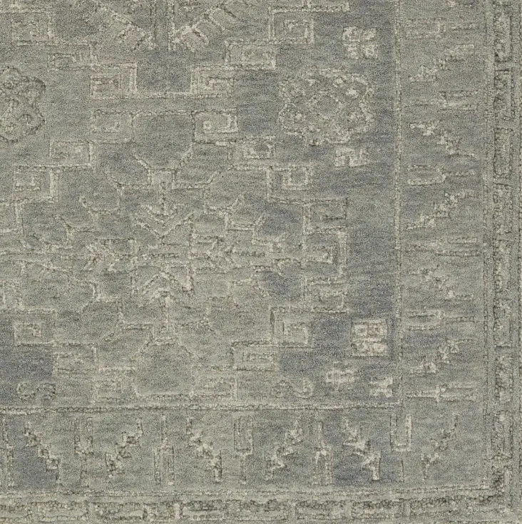 Vintage distressed gray area rug with intricate patterns, perfect for modern or traditional interiors.