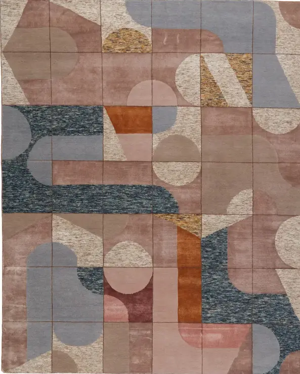 Vibrant geometric area rug with circular and rectangular patterns in pink, blue, beige, and terracotta tones for modern interior decor.