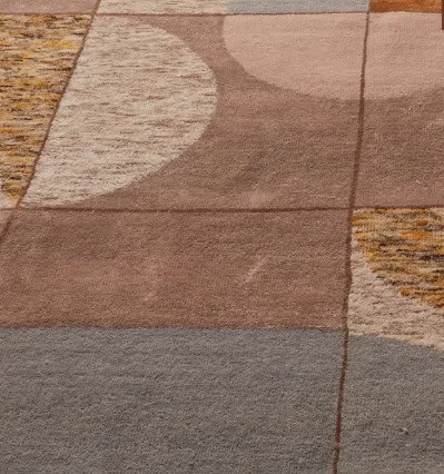 Colorful modern carpet tiles with geometric pattern in shades of brown, beige, and gray for stylish interior flooring.