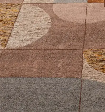 Colorful modern carpet tiles with geometric pattern in shades of brown, beige, and gray for stylish interior flooring.