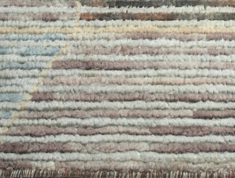 Soft plush area rug with neutral tones, perfect for cozy living spaces and adding warmth to your home decor.