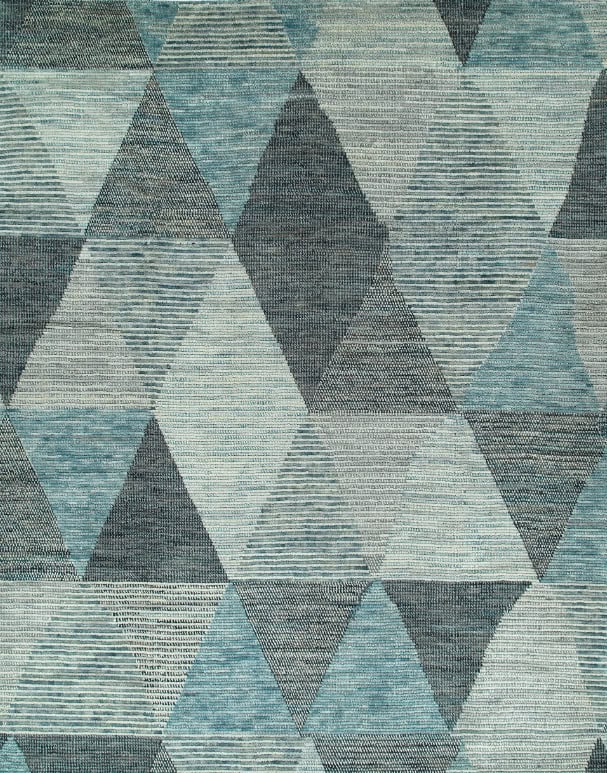 Soft geometric area rug with blue, gray, and cream tones, perfect for modern flooring.