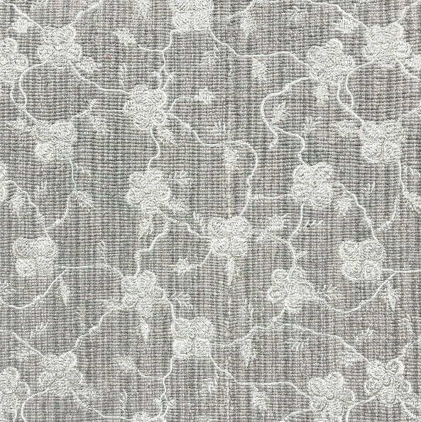 Intricate floral patterned carpet in neutral tones, ideal for elegant residential and commercial flooring.
