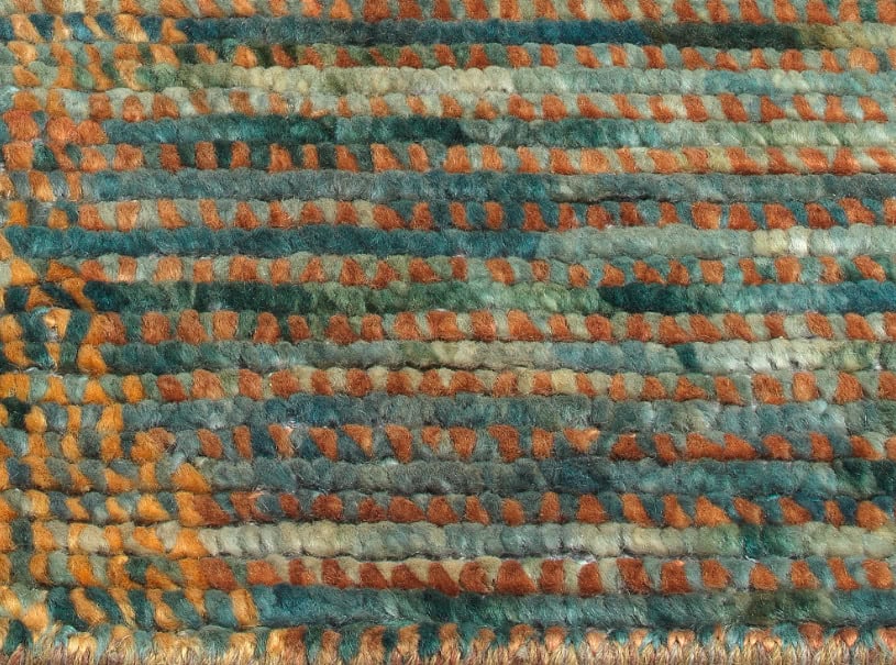Vibrant multicolored woven rug with orange, blue, and green tones, perfect for home flooring.