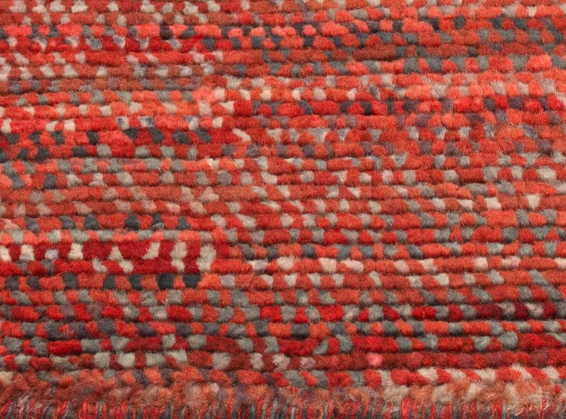 Vibrant red and gray area rug showcasing plush, textured, and durable flooring options at Creative Floors.