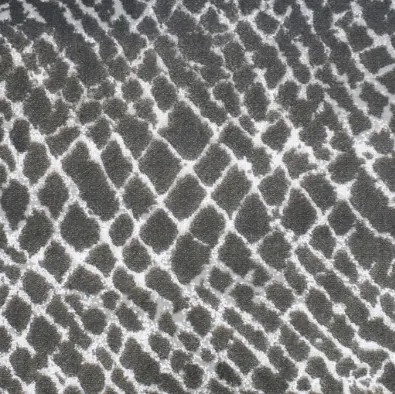 Intricate black and white animal print rug showcasing stylish flooring design.