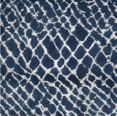 Vibrant navy and white patterned area rug for modern living spaces.