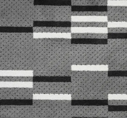 Soft gray and black patterned carpet with white accents, ideal for modern flooring solutions.