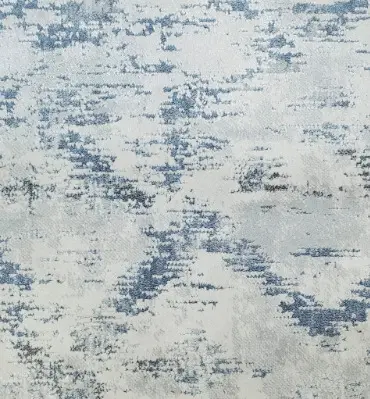 Wool area rug with abstract blue and cream pattern for stylish home decor.