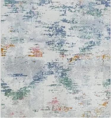 Vibrant abstract area rug with blue, green, and orange tones for modern living spaces.