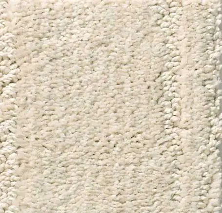 Soft cream textured carpet flooring for home or commercial spaces.