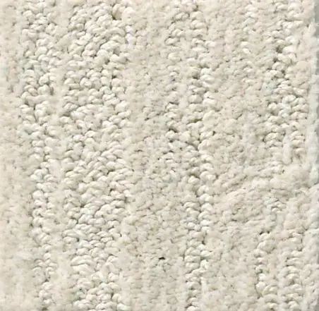 Soft beige plush carpet with textured fibers, ideal for cozy and stylish home flooring.