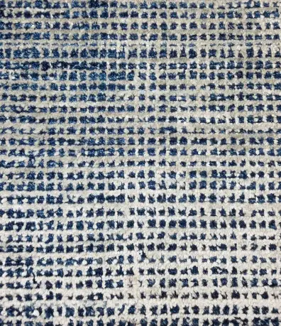 Elegant patterned blue and white area rug from Creative Floors for stylish home décor.