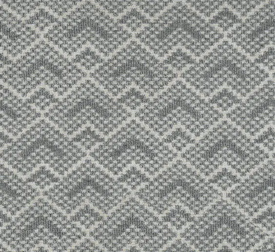 Luxurious textured gray and beige patterned carpet fiber for elegant home flooring.