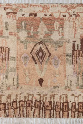 Intricate Persian-style area rug with geometric patterns and warm neutral tones for elegant home decor.
