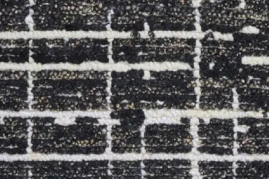 Black and white textured brick floor for modern interior design and durable flooring solutions.