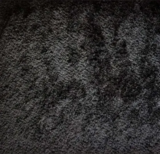 Luxurious dark carpet flooring for residential and commercial spaces.