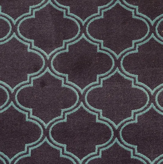 Luxurious patterned area rug with geometric design, perfect for enhancing any room's decor.