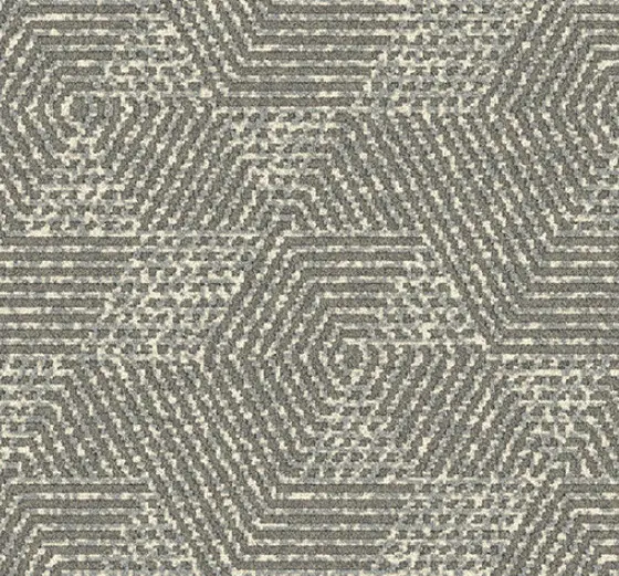 Intricate geometric patterned carpet for home or office flooring.