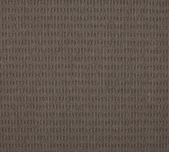 Beige textured commercial carpeting with subtle pattern, perfect for office or retail flooring solutions.