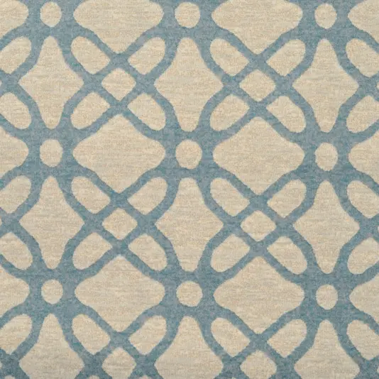 Soft beige and blue patterned area rug with geometric design for modern interior decor.