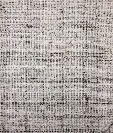 Modern textured area rug with neutral tones, perfect for contemporary home decor.