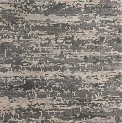 Vibrant gray and beige abstract carpet with textured pattern for modern interior design.
