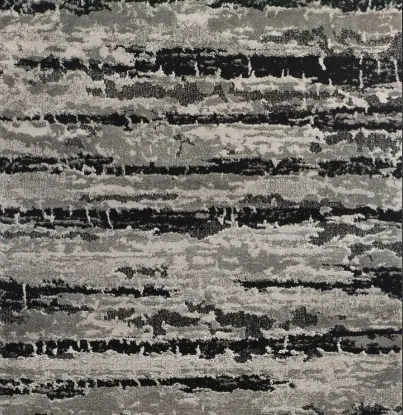 Stylish abstract rug with textured gray and black tones for modern interior design.