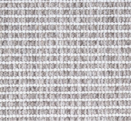 High-quality textured carpet flooring in neutral tones for residential and commercial spaces.