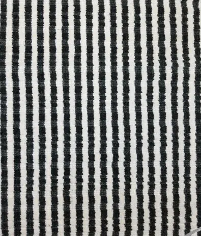 Stripe black and white area rug with textured pattern for modern interior decor.