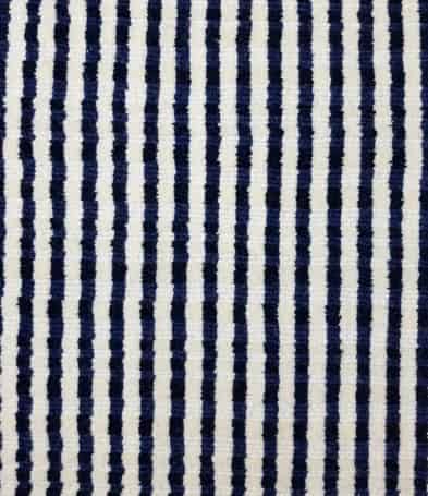 Vibrant striped area rug with navy and cream pattern for modern flooring designs.