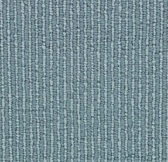 Soft blue textured carpet with linear pattern, ideal for commercial and residential flooring solutions.
