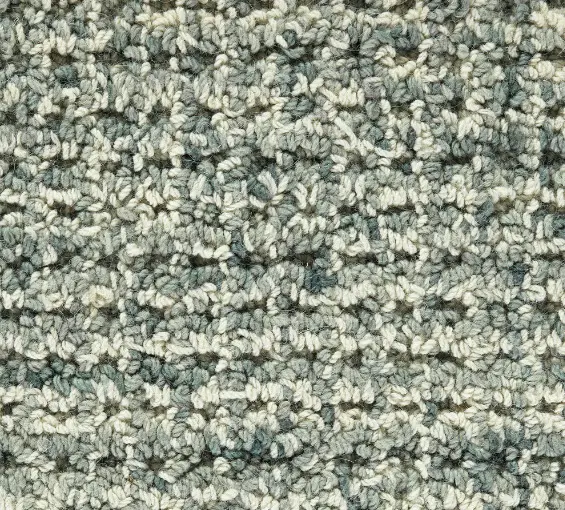 Soft textured beige and gray carpet for residential or commercial flooring.
