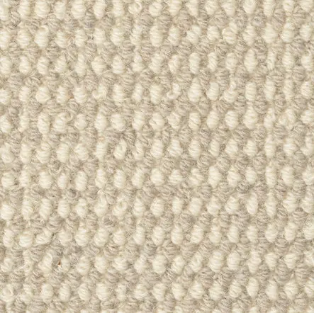Cream textured carpet close-up with plush pile for interior flooring.