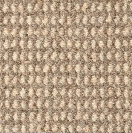 Soft beige textured carpet with plush fibers, ideal for residential and commercial flooring solutions.