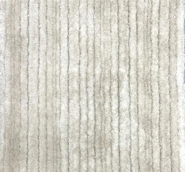 Cream textured carpet with subtle stripe pattern, ideal for residential or commercial flooring.