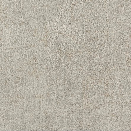 Cream textured carpet with plush pile, ideal for indoor flooring and home decor.