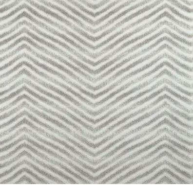 Elegant chevron-patterned area rug in neutral tones, perfect for modern interior design.