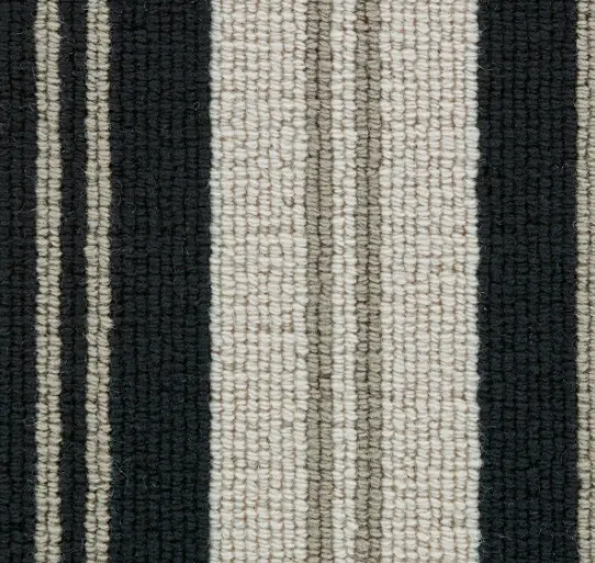 Soft black, beige, and taupe striped carpet with textured fibers for cozy, stylish flooring.