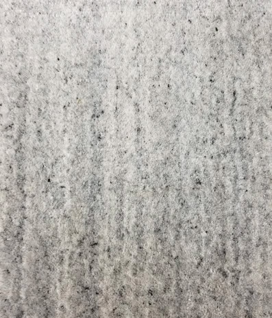 Concrete floor surface with a textured finish for durable residential and commercial flooring solutions.