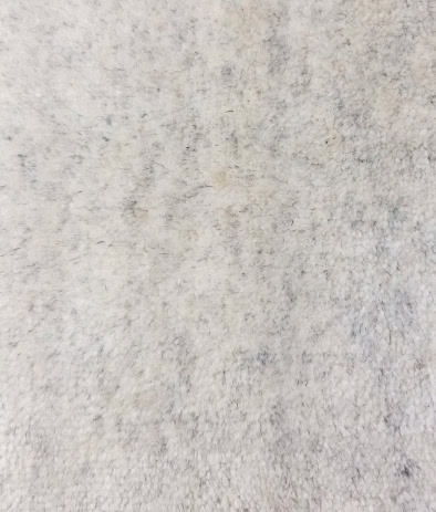 Textured concrete flooring surface in neutral tones, ideal for modern interior and exterior designs.