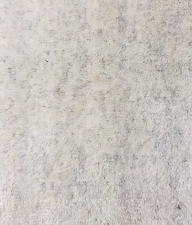 Textured concrete flooring surface in neutral tones, ideal for modern interior and exterior designs.