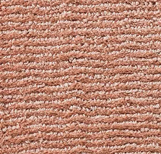 Soft pink plush carpet with textured weave, ideal for cozy home flooring.